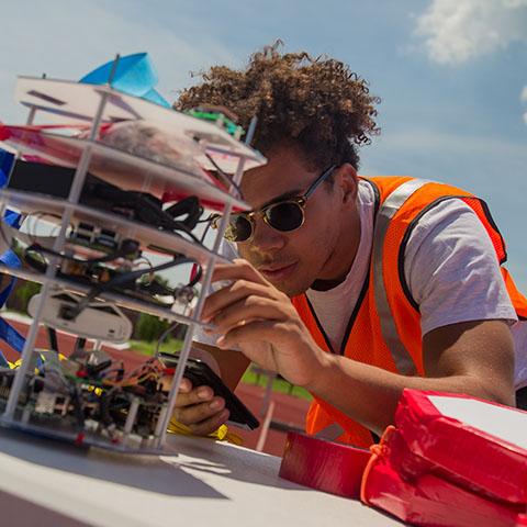 Dominic Critchlow works on weather balloon